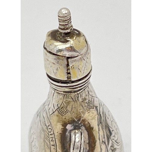 1156 - A late 17th Century silver scent flask of pilgrim form with engraved scene of Cupid to one side and ... 