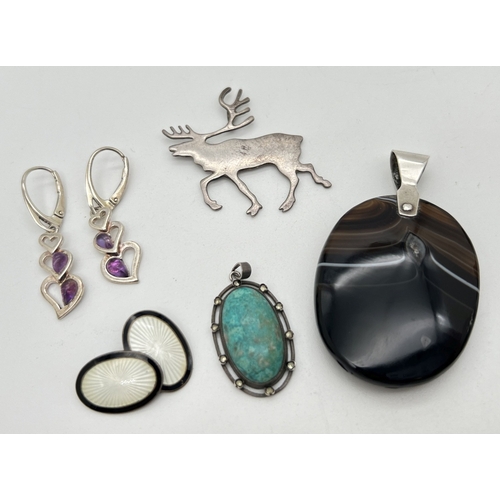 1064 - A small collection of silver and white metal jewellery. To include a large oval banded agate pendant... 