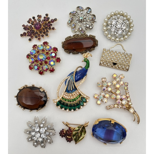 1066 - 12 vintage stone and faux pearl set brooches.  To include floral, fruit, peacock and single stone de... 