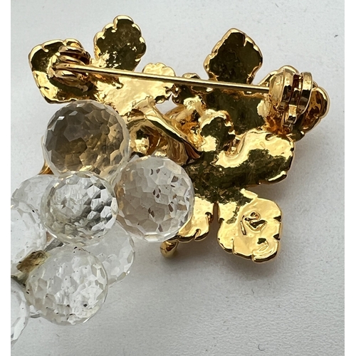 1067 - 3 boxed Swarovski crystal and gold tone brooches from the Crystal memories range. A double cherry br... 