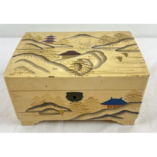 1068 - A vintage cream wooden jewellery box with oriental design to exterior and inside compartments. Conta... 