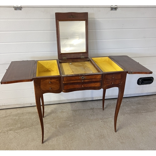 1358 - A Victorian vanity dressing table with inlaid marquetry detail and brass hardware. Central panel lif... 