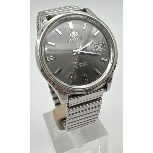 1130 - A men's vintage Automatic wristwatch by Orient, with stainless steel case and expanding strap. Grey ... 