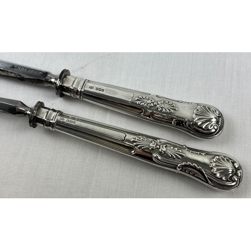 1163 - 2 silver handled carving set items, a meat fork and honing steel, with Kings pattern handles. Both f... 