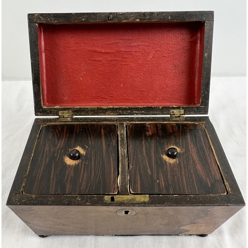 1315 - A vintage wooden sarcophagus shaped tea caddy with small bun feet and brass key escutcheon. Two lidd... 