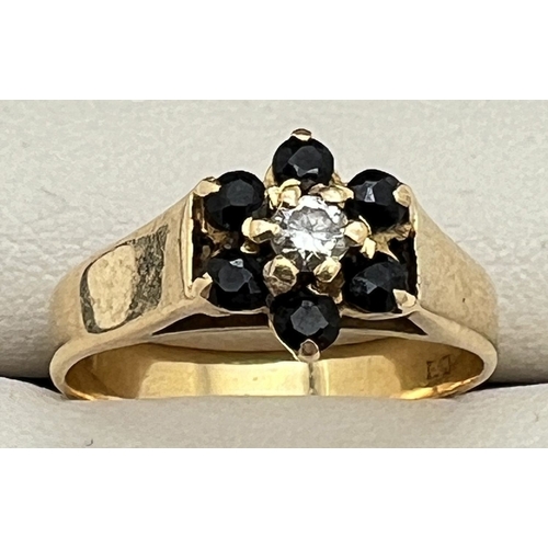 1072 - A vintage 18ct gold flower design sapphire and diamond ring. Fully hallmarked inside band. Total wei... 