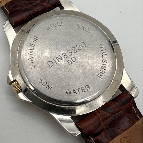 1138 - An Ingersoll silver & gold tone cased quartz wrist watch DIN 33230 with brown leather strap. Luminou... 