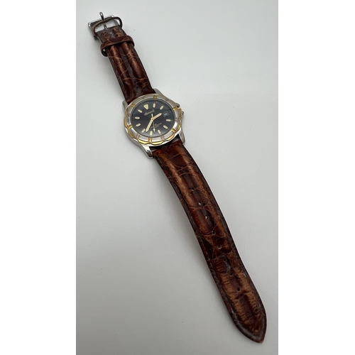 1138 - An Ingersoll silver & gold tone cased quartz wrist watch DIN 33230 with brown leather strap. Luminou... 