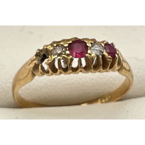 1081 - A vintage 18ct gold, ruby and diamond ring with pierced work mount (1 ruby missing). Fully hallmarke... 