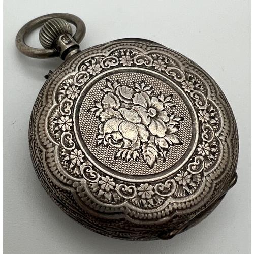 1142 - A Victorian silver ladies pocket watch with engraved design to case and floral detail to face. Hallm... 