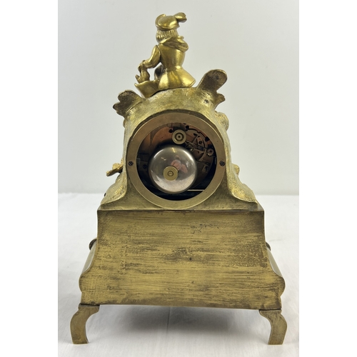 1240 - A vintage ornate brass striking mantle clock in a Rococo style with figure of a boy to top. Enamel f... 