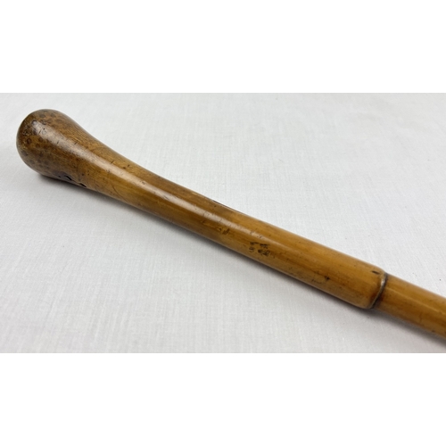 1234 - An antique Malacca pommel topped military walking cane with unmarked white metal insert. Engraved wi... 