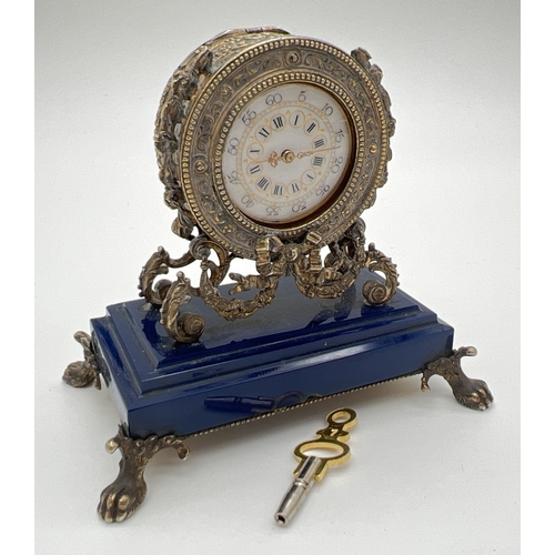 1175 - An antique Continental 800 silver gilt miniature clock, possibly French, with key. Highly ornate sil... 