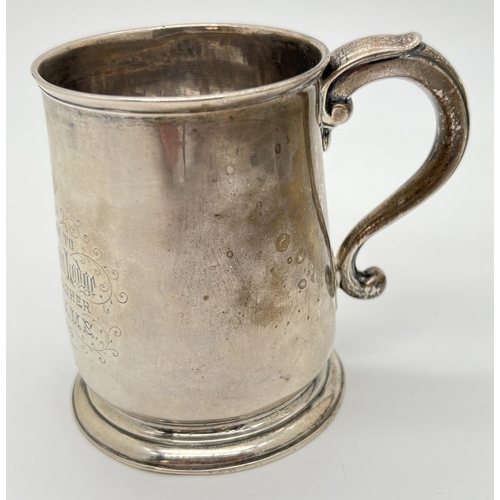 1179 - A George II silver mug with later engraved detail, hallmarked to underside - London, 1731. Makers ma... 