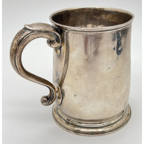 1179 - A George II silver mug with later engraved detail, hallmarked to underside - London, 1731. Makers ma... 