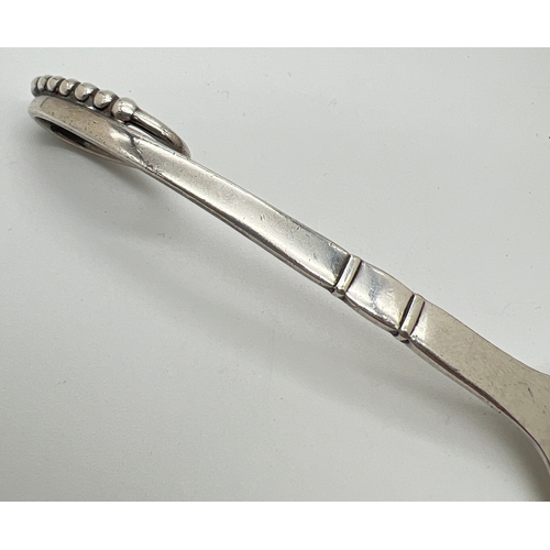 1182 - A mid century Georg Jensen silver spoon, model No. 41, with leaf design bowl and beaded accent to lo... 