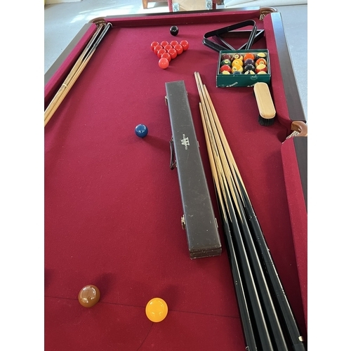 1352 - An 8ft x 4ft solid mahogany slate bed Pool/Snooker and Dining table. With Windsor red cloth and turn... 