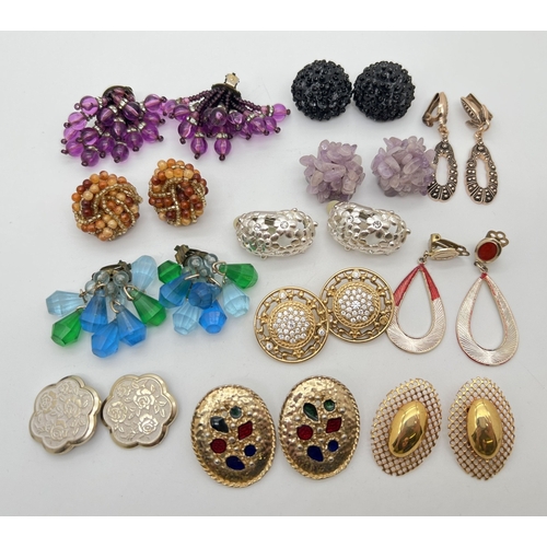 135 - 12 pairs of vintage statement clip on earrings in stud and drop styles. To include large amethyst ch... 