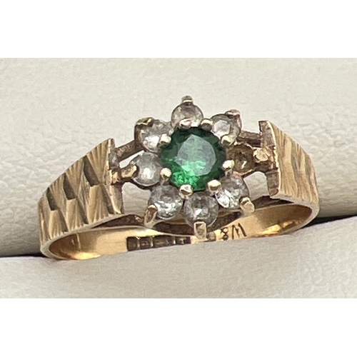 182 - A vintage 9ct gold cluster style ring with central green spinel stone surrounded by 7 round cut clea... 