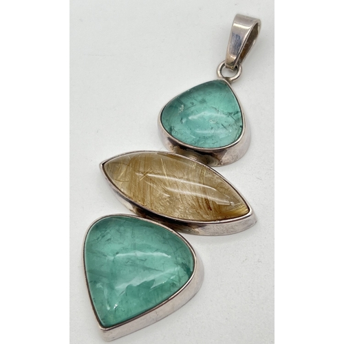 1023 - A large silver modern design pendant set with 2 teardrop cut flourite cabochons and a marquise cut A... 