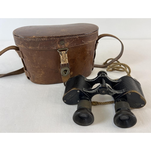 1287 - An antique pair of Victorian c1873 Voigtlander Braunschweig 6 x 24 binoculars with original leather ... 