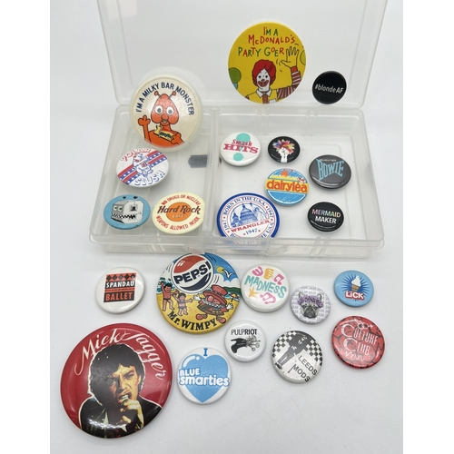 1304 - A small collection of vintage pin badges, mostly 1980's food advertising and music bands. To include... 