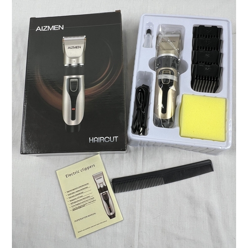 1314 - Aizmen Electric Hair Clippers, brand new in box. Complete with grading attachments and instruction b... 