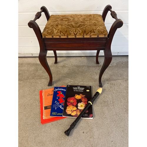 1323 - A Victorian mahogany piano stool with cabriole style legs, turned handles and lift up upholstered se... 