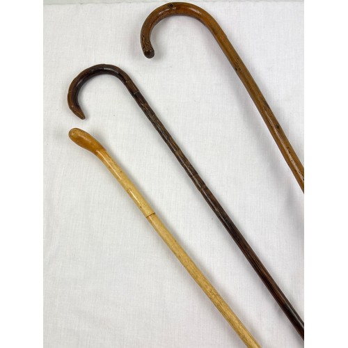 1326 - 3 antique walking canes or stockman's sticks, 2 curve handled. Longest approx. 85cm long.