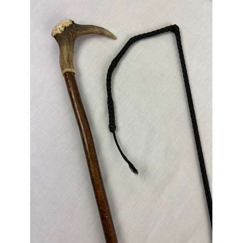 1327 - A vintage carriage driver's horse whip together with a walking stick with deer antler handle. Whip a... 