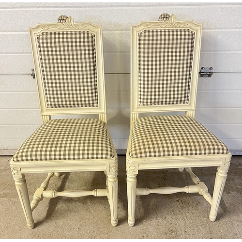 1355 - A pair of modern dining chairs with white painted wooden frames and grey & cream check upholstered s... 