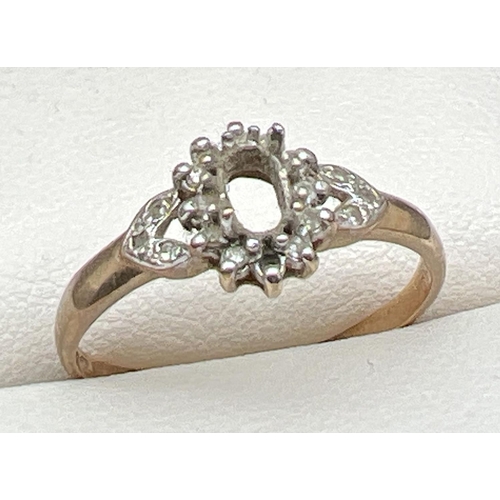 10 - A 9ct gold vintage dress ring set with small round cut diamonds. Central stone missing and one small... 