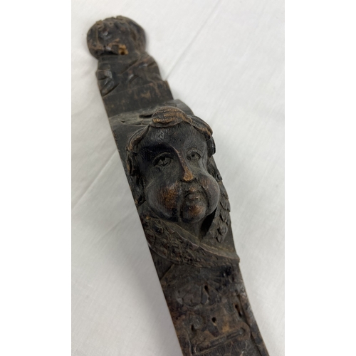 1343 - An antique carved dark wood piece of moulding, approx. 98cm long.