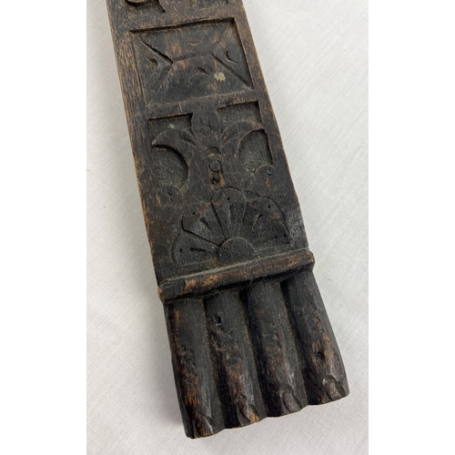 1343 - An antique carved dark wood piece of moulding, approx. 98cm long.