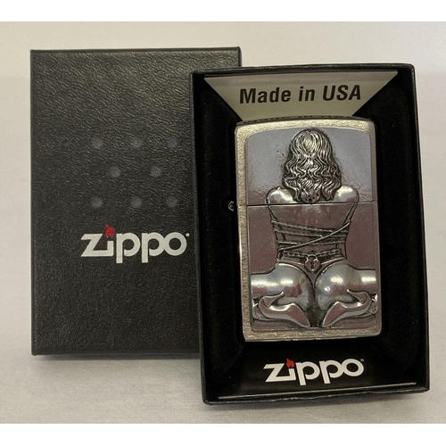 1344 - An erotic design boxed zippo lighter with inscription to back 