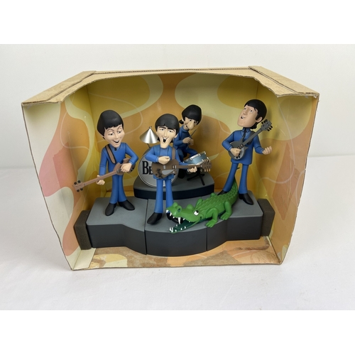143 - A Deluxe Boxed Set The Beatles by McFarlane Toys. Characters are based on the 1965 animated TV serie...