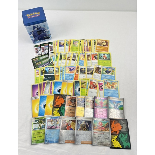 56 - A water (blue) Pokemon stacking tin containing 145 assorted Pokemon cards. Comprising: 10 holo's & r... 
