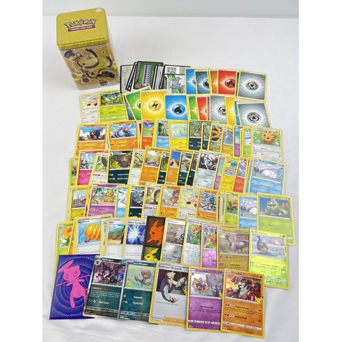 60 - An electric (yellow) Pokemon stacking tin containing 145 assorted Pokemon cards. Comprising: 10 holo... 