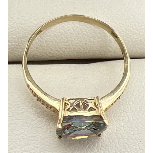 1001 - A 9ct gold and mystic topaz ring with large cushion cut stone and engraved detail to shoulders. Stam... 