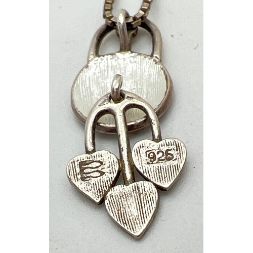 1003 - A 925 silver Rennie Macintosh rose design articulated pendant on an 18