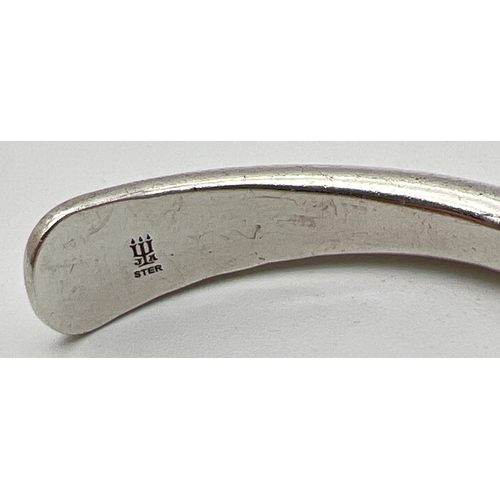 1004 - A vintage silver hammered effect cuff bangle by James Avery. Makers mark and silver mark to inside o... 