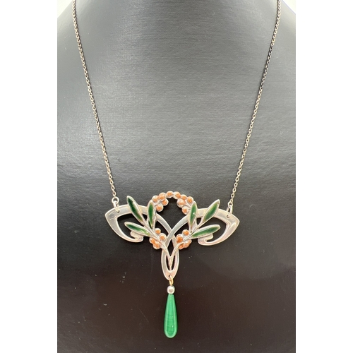 1008 - An Art Nouveau style fixed pendant necklace with enamelled leaf & berry design and green glass drop.... 