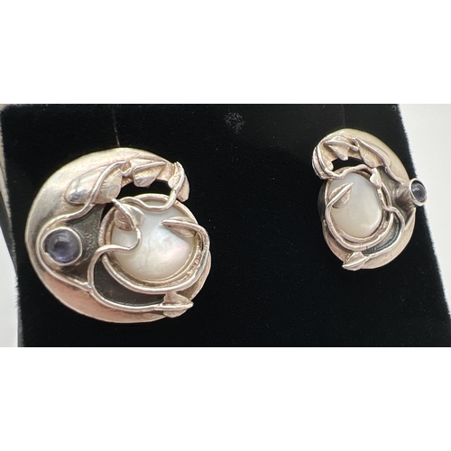 1018 - A pair of Art style Nouveau style stud earrings with Ivy leaf design and mother of pearl and amethys... 