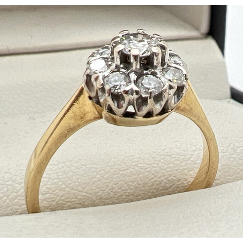 1020 - A vintage 18ct yellow gold diamond cluster ring. Central 0.10ct diamond surrounded by 8 smaller roun... 