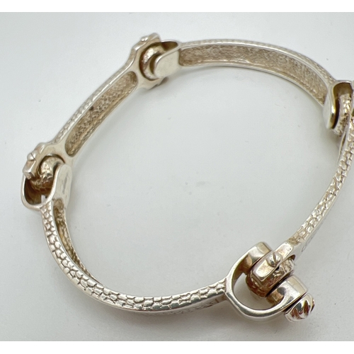 1025 - A modern design silver 4 panel bracelet with snake skin design to each panel. Screw link detail and ... 