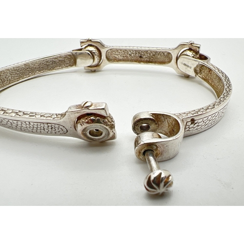 1025 - A modern design silver 4 panel bracelet with snake skin design to each panel. Screw link detail and ... 