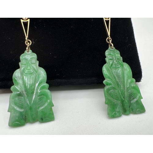 1033 - A pair of vintage 9ct gold, jade and pearl drop earrings with lever backs. Carved Chinese deity jade... 