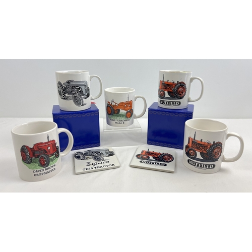 1269 - A collection of ceramic mugs with printed tractor designs, to include 2 boxed Norfolk China gift set... 