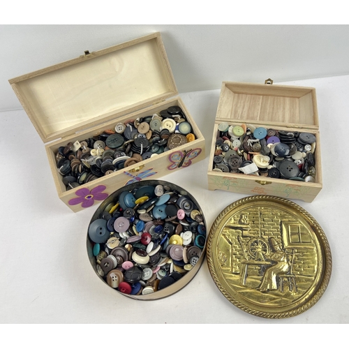 1322 - 3 boxes of assorted vintage buttons, in varying sizes and designs.