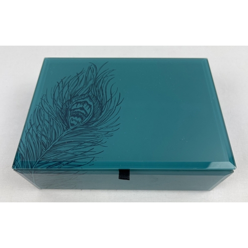 1051 - A modern glass jewellery box containing a quantity of assorted modern & vintage costume jewellery. T... 